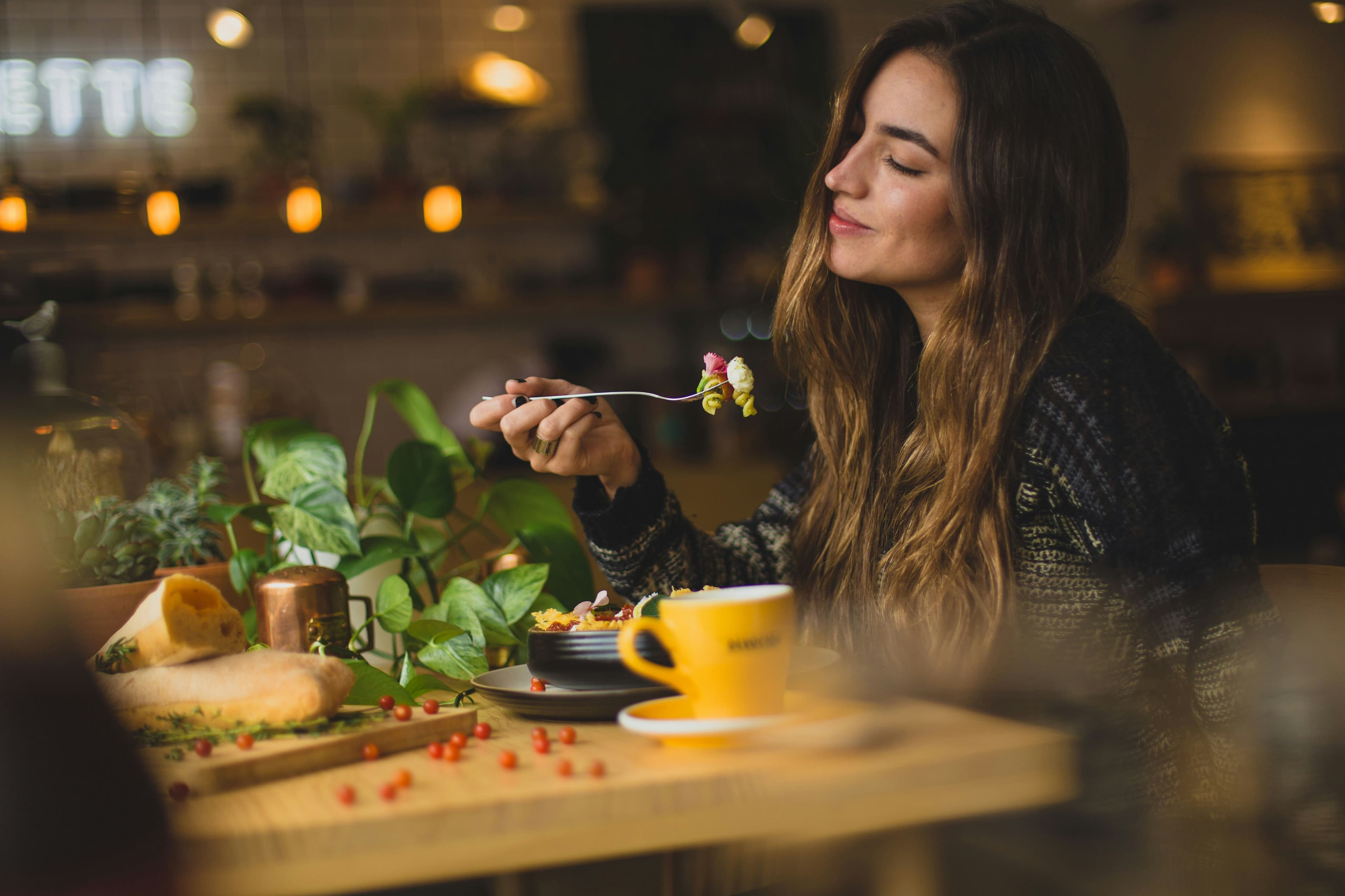 Woman enjoying a fresh Eatcious meal